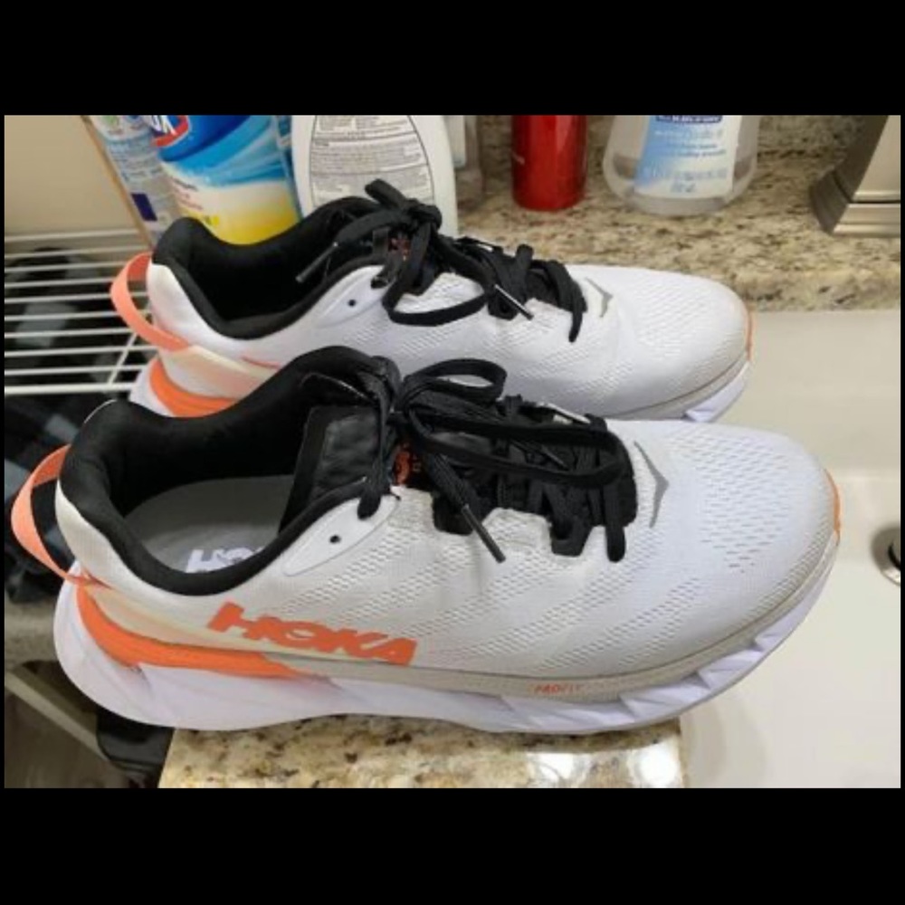 white and orange Hoka women’s shoes